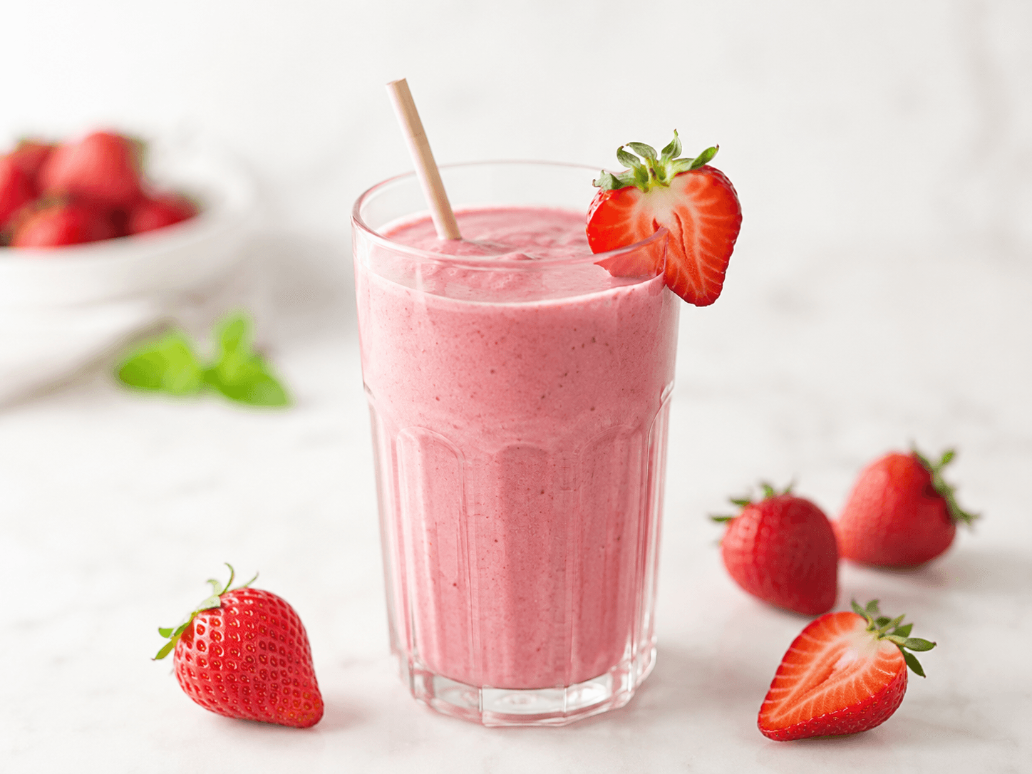 Creamy strawberry smoothie with fresh strawberries